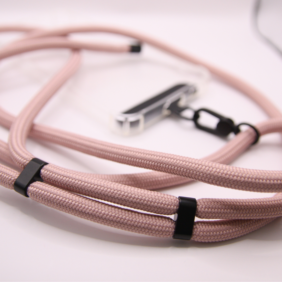 Close-up of the baby pink crossbody phone strap rope.