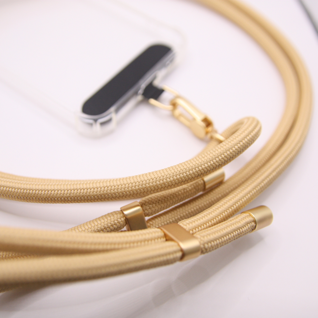 Close-up of the beige coloured crossbody phone strap rope.