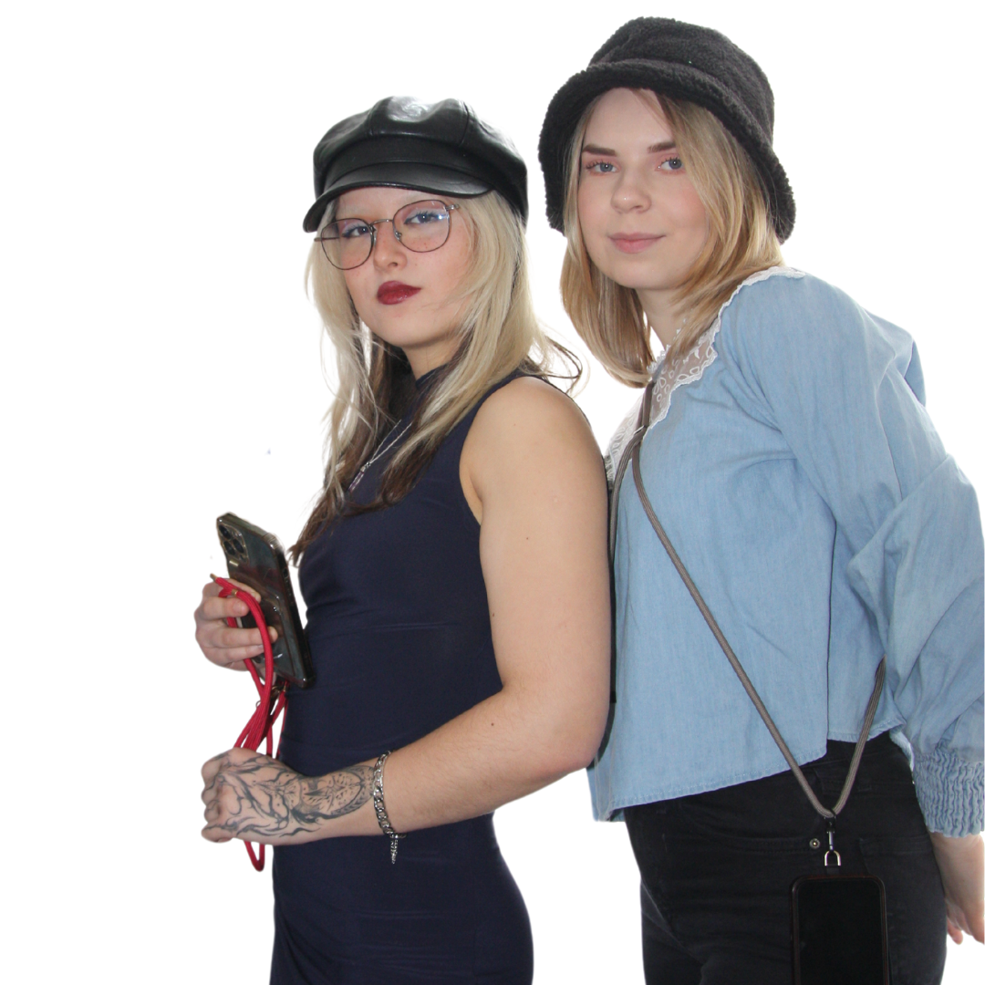 Two girls looking in the camera. Wearing different crossbody phone strap ropes.