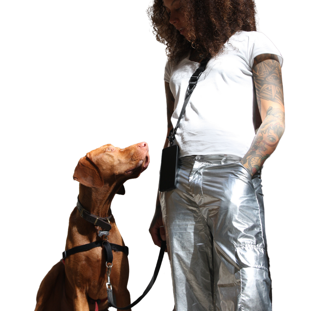 Girl poses with dog. Wearing 2-in-1 Utility Lanyard Crossbody phone strap black. 