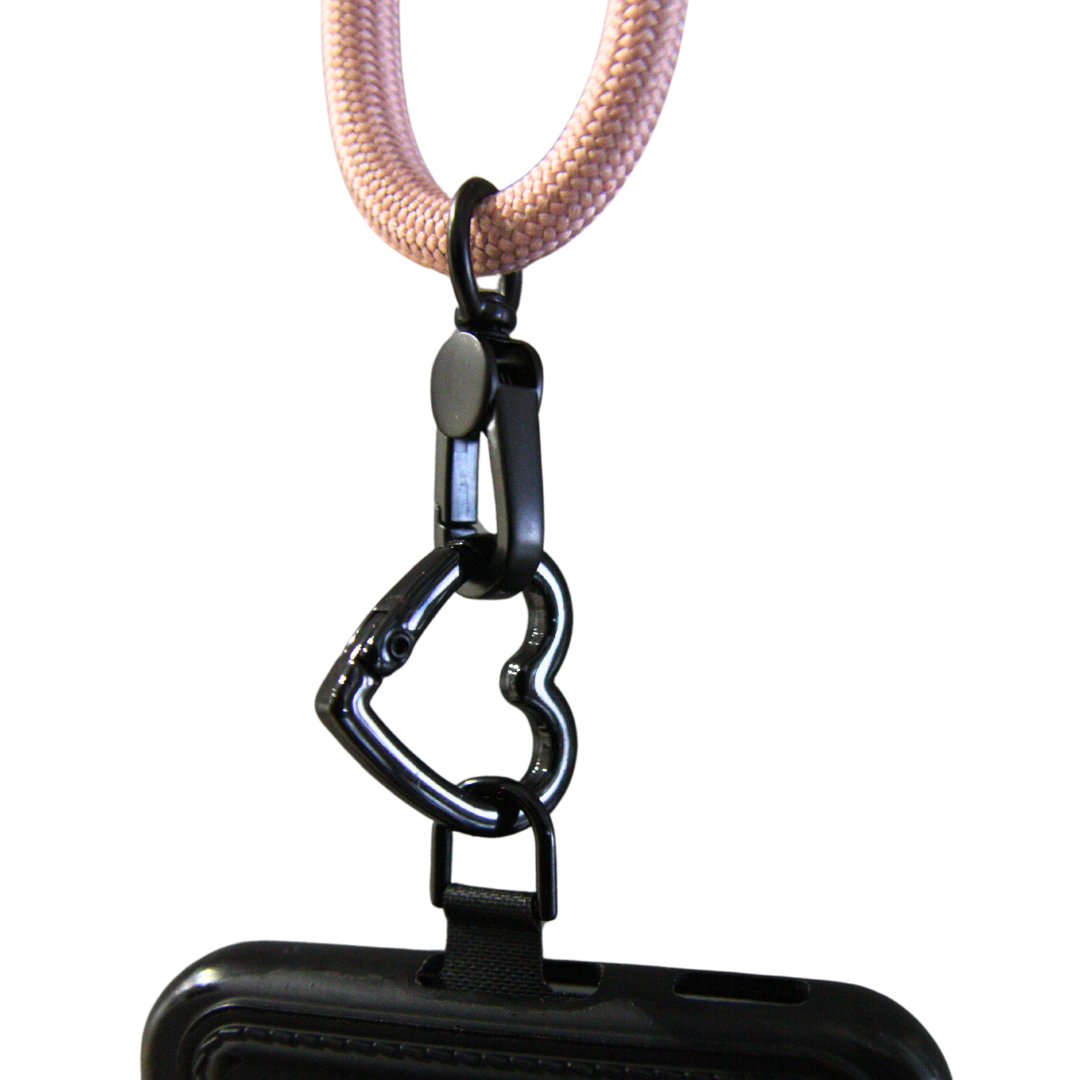 Crossbody phone strap connected with heart shaped carabiner.