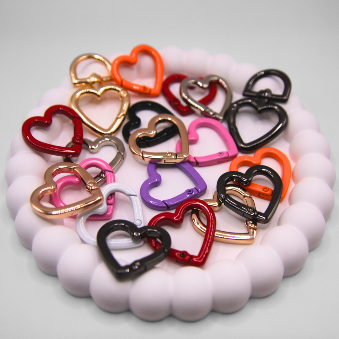 Heart carabiners with different colours together.